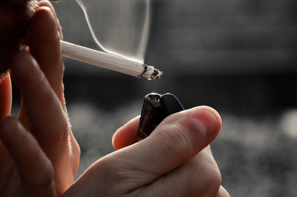Person avoiding tobacco to protect oral health and overall well-being